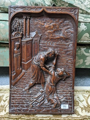 Lot 382 - A Continental walnut plaque carved in high...