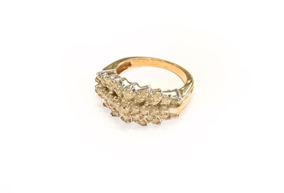 Lot 263 - A 9 carat gold diamond cluster ring, finger...