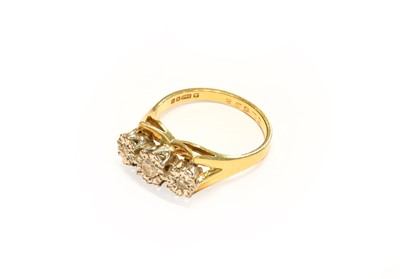 Lot 271 - An 18 carat gold diamond three stone ring,...