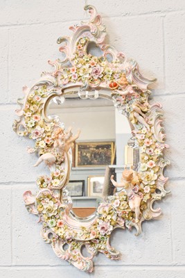Lot 319 - A 20th century Meissen style pier mirror, with...