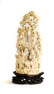 Lot 70 - A Japanese Meiji period carved ivory okimono,...