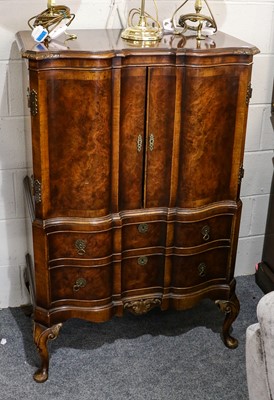 Lot 1365 - A reproduction figured walnut serpentine...