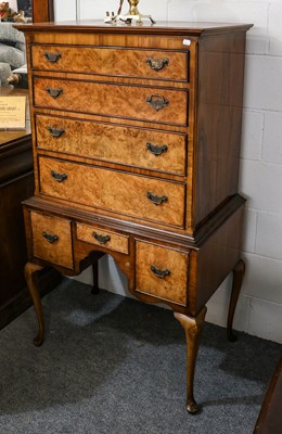 Lot 1367 - A reproduction walnut Queen Anne style tallboy,...