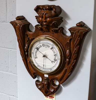 Lot 1202 - A Victorian carved oak aneroid barometer,...