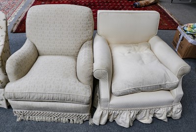 Lot 1268 - A feather-filled armchair in cream floral...