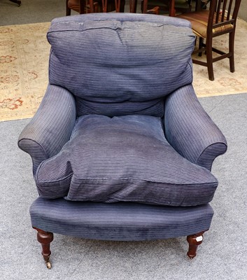 Lot 1251 - A 20th century Howard style armchair in blue...