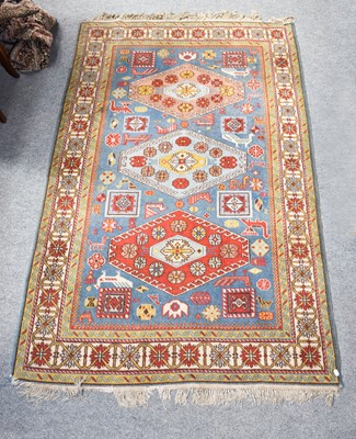 Lot 1313 - A Caucasian design rug, the sky blue field...