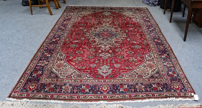 Lot 1302 - A Tabriz carpet, the raspberry field of...