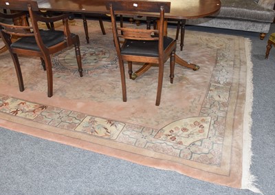 Lot 1319 - A Chinese carved carpet, the soft candy pink...