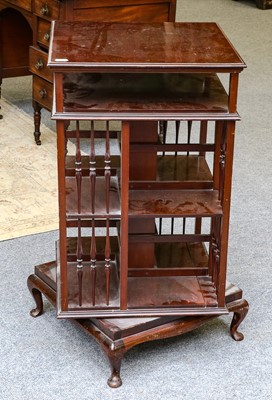 Lot 1409 - A mahogany revolving bookcase