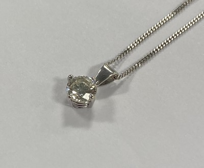 Lot 2104 - An 18 Carat White Gold Diamond Solitaire Pendant on Chain