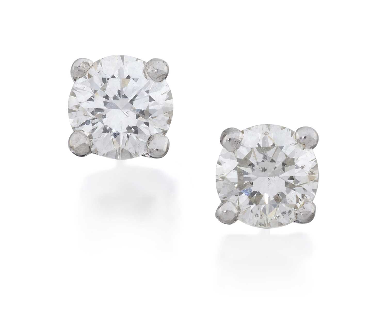 Lot 2164 - A Pair of Diamond Solitaire Earrings