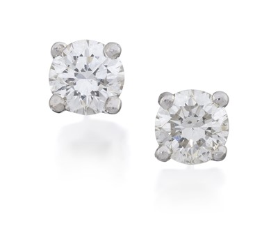 Lot 2164 - A Pair of Diamond Solitaire Earrings