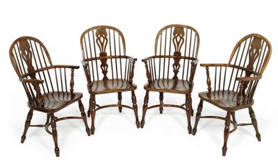 Lot 1127 - A Set of Four Stewart Linford Yewwood Windsor Chairs, dated 24.5.1981, with double spindle back...