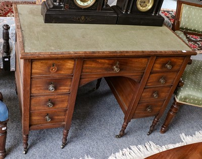 Lot 1397 - An Edwardian mahogany kneehole writing desk,...