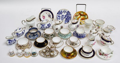 Lot 93 - A quantity of miniature porcelain tea and...