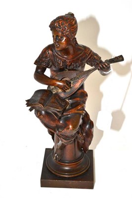 Lot 312 - An Art Nouveau cold painted bronze figure playing a mandolin, 32cm high