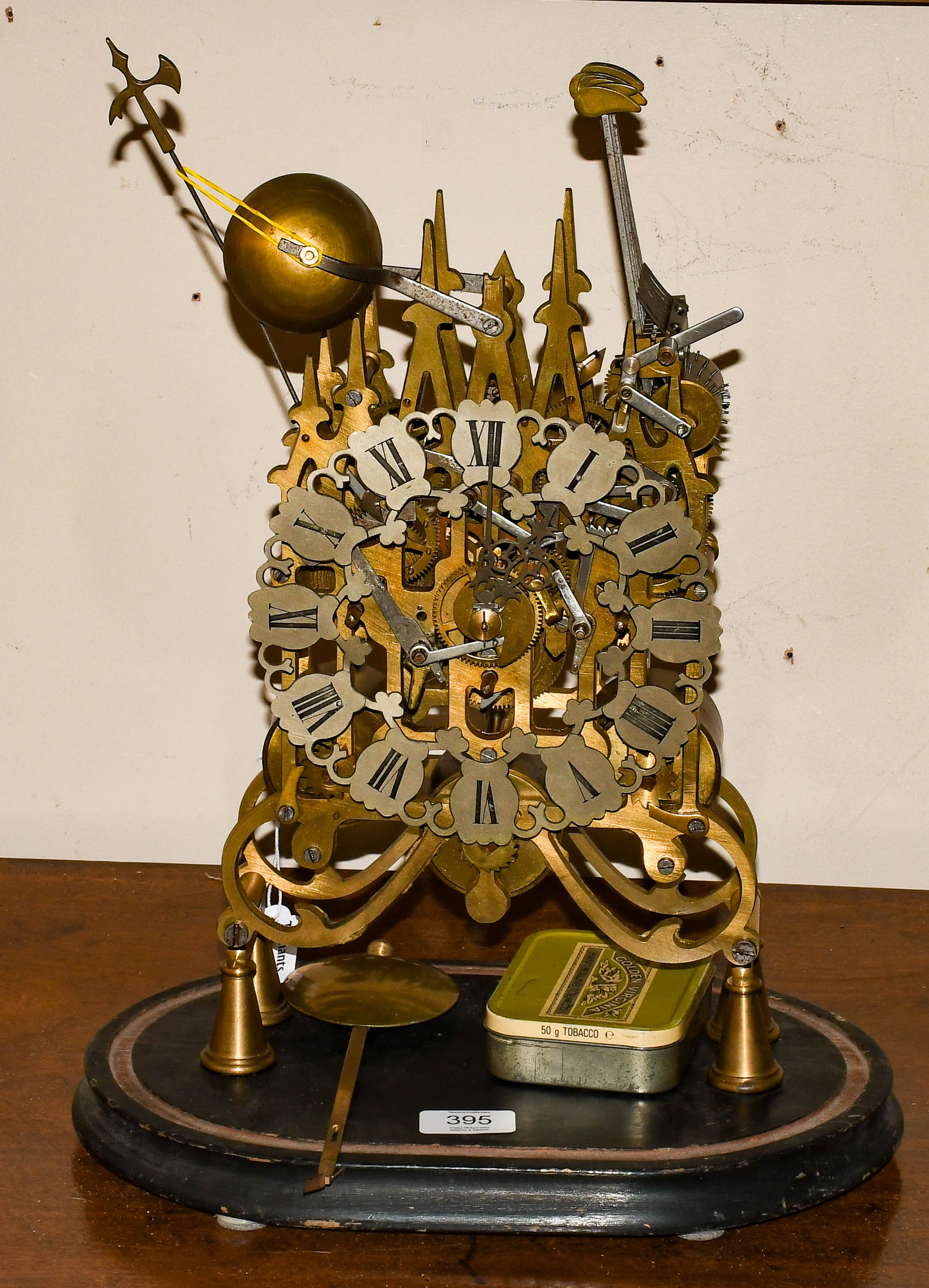 Lot 395 A modern reproduction skeleton clock,