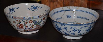 Lot 321 - An early 18th century English Delft punch bowl, painted in colours with chinoiserie foliage and...