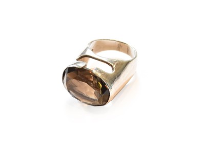 Lot 372 - A silver smoky quartz ring, circa 1970, finger...