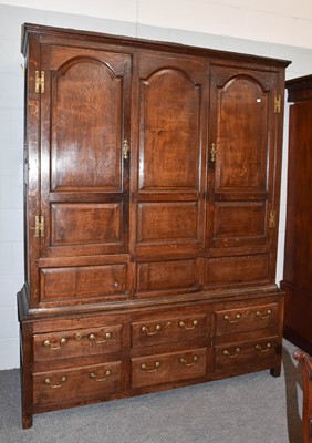 Lot 1333 - An 18th century joined oak livery cupboard,...