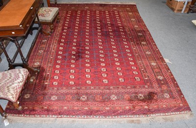 Lot 1300 - An Afghan Turkmen rug, the claret field with...