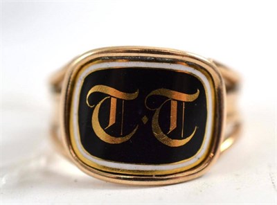 Lot 333 - A black and white enamelled mourning ring with initials ";TT"; on a cushion shaped panel to...