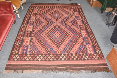 Lot 1310 - An Afghan Kilim, the field with radiating...