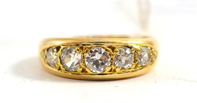 Lot 334 - A diamond five stone ring, a round brilliant cut centrally, flanked by graduated pairs of old...