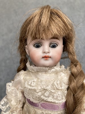 Lot 86 - Miniature bisque jointed doll with sleeping...