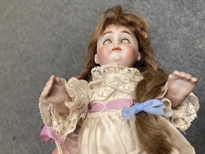 Lot 86 - Miniature bisque jointed doll with sleeping...