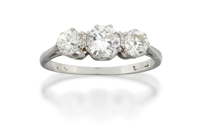 Lot 2061 - A Diamond Three Stone Ring the graduated round...