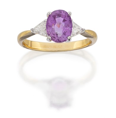 Lot 2138 - A Pink Sapphire and Diamond Three Stone Ring