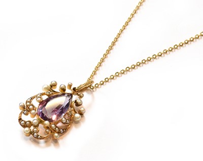 Lot 348 - An amethyst and split pearl pendant on chain,...