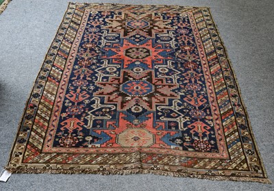 Lot 1005 - A Lesghi rug, the indigo field with a column...