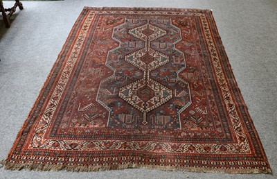 Lot 1010 - A Kashgai rug, the mid indigo field with three...