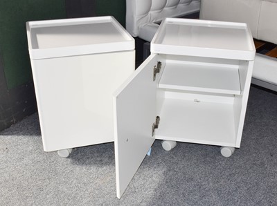 Lot 1348 - A modern white painted open shelving unit,...