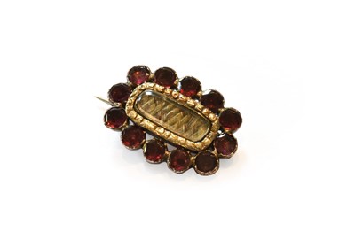 Lot 368 - A mourning garnet and hair work brooch, length...