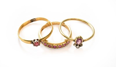 Lot 349 - A synthetic ruby half hoop ring, stamped '750',...