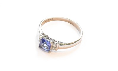 Lot 339 - A tanzanite and diamond ring, stamped '18K',...