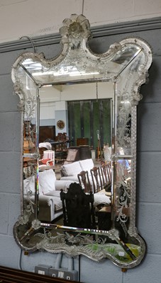 Lot 1191 - A Venetian style mirror applied with moulded...
