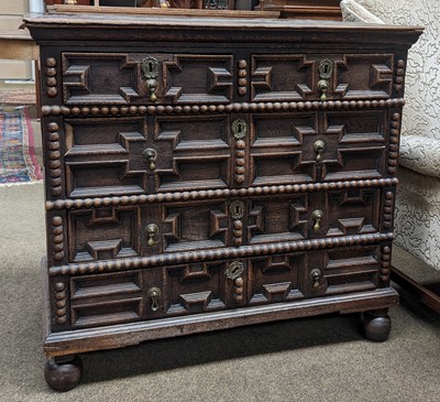 Lot 1127 - A 17th Century Oak Geometric Chest of Drawers,...