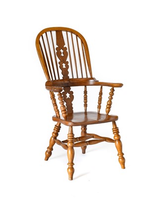 Lot 312 - A Modern Elm Broad Arm Windsor Chair, high...