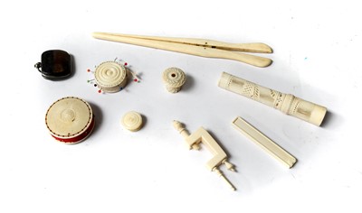Lot 334 - A collection of 19th century ivory sewing...