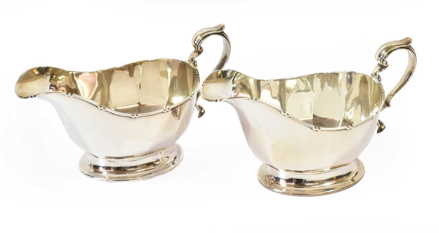 Lot 84 - A Pair of Elizabeth II Silver Sauceboats, by...