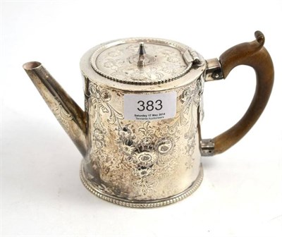 Lot 383 - A George III silver teapot, London 1775, with later repoussé decoration (handle a.f.)