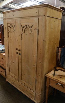 Lot 1181 - A Victorian pine wardrobe with carved panelled...