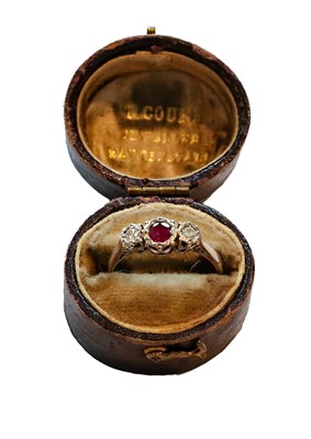 Lot 405 - An 18 carat white gold ruby and diamond three...