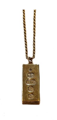 Lot 385 - A 9 carat gold ingot on a 9 carat gold rope...