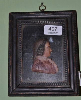 Lot 407 - A wax miniature portrait of a gent